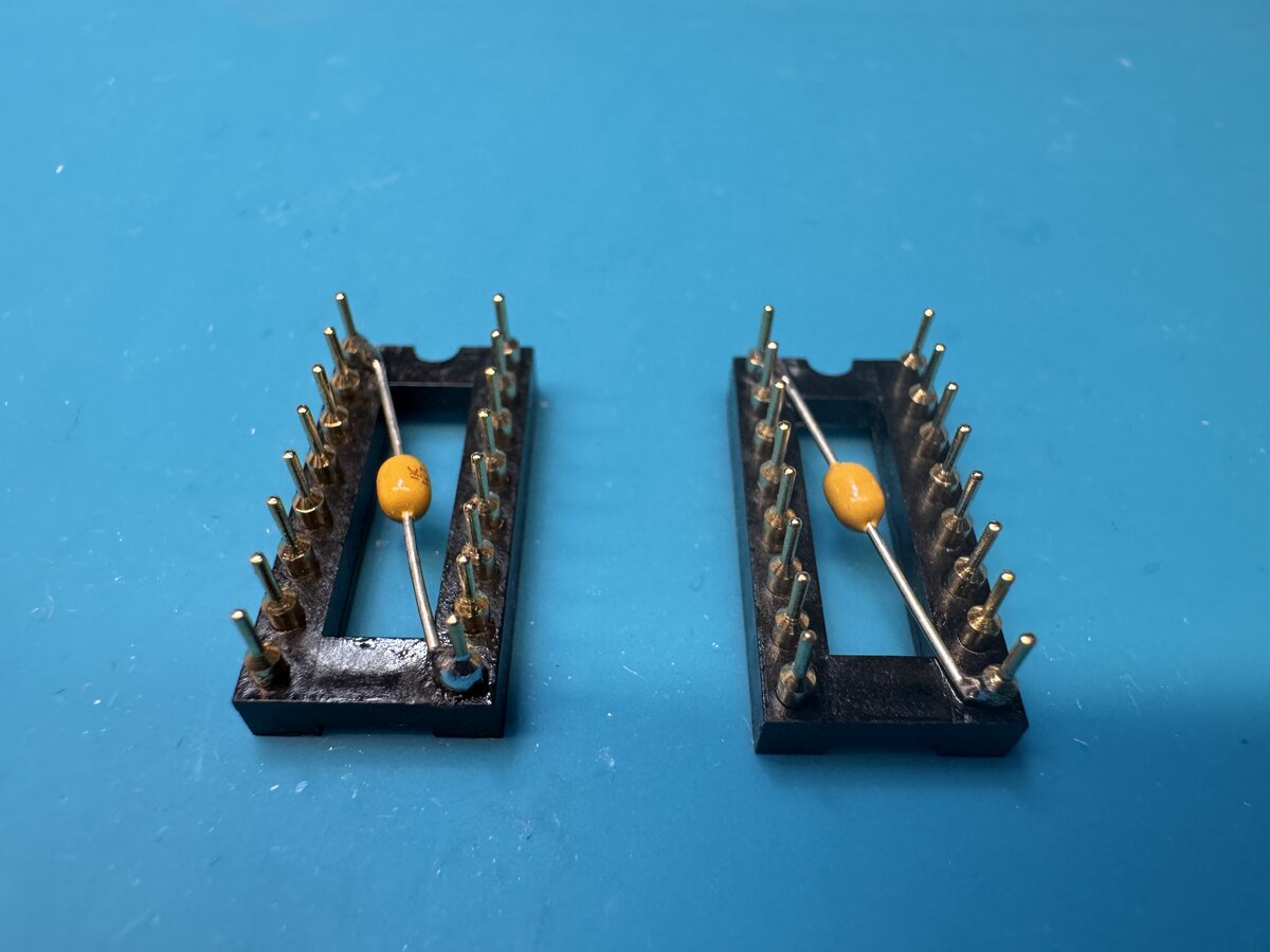 The decoupling capacitors for the PROMs
