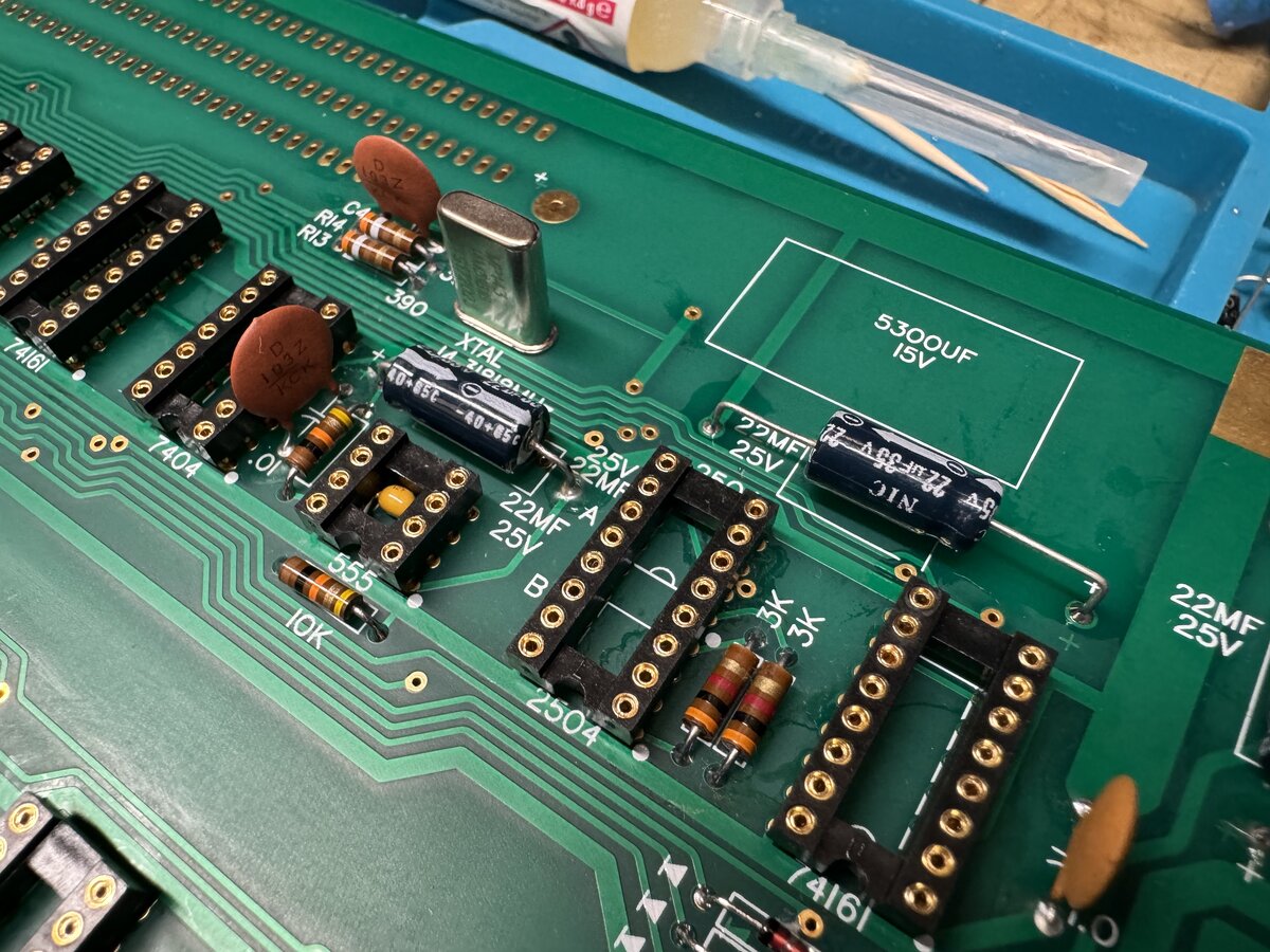 Section with resistors, IC sockets, capacitors, and the quartz