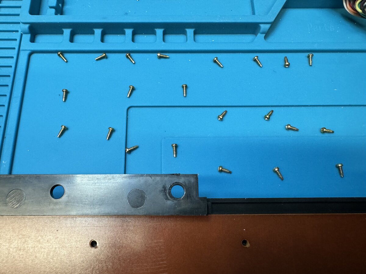 The keyboard's bottom PCB screws